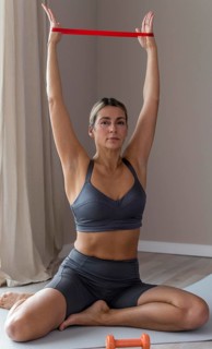 Sporty woman blue fitness clothes using accessories