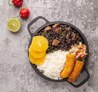 Tasty brazilian dish with orange top view
