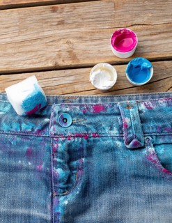 Top view colored jeans with paint