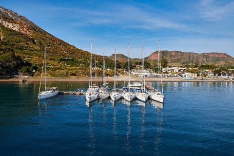 Sailboats in a row next to each other