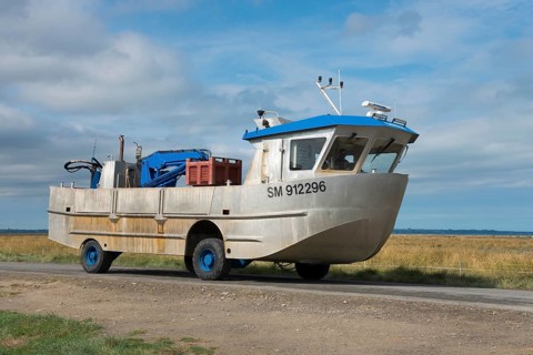 Amphibious vehicle on the road on the way to the mussel harvest