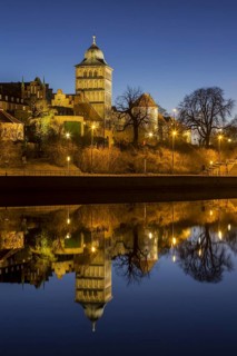 Gothic Burgtor Gate reflected in water of the Elbe Luebeck Canal