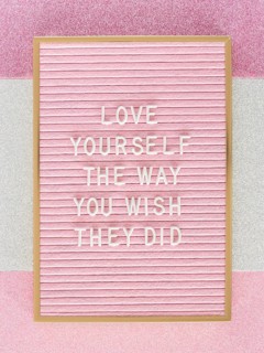 Pink motivational text board top view
