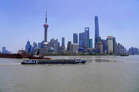 View of the skyline from the Bund on the Huangpu River with Oriental Pearl Tower