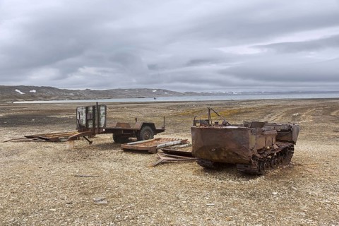Rusty amphibian vehicle at deserted 1950s Kinnvika Arctic research station