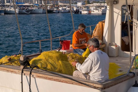 Fishermen mending nets