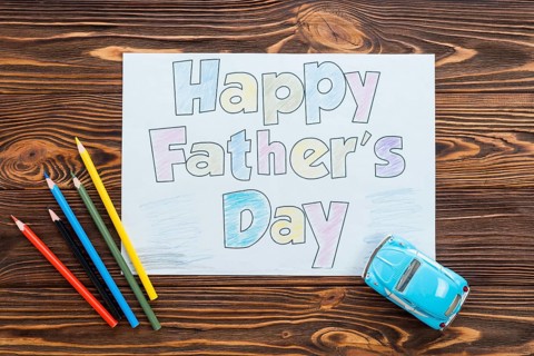 Happy fathers day inscription with toy car