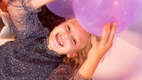 Portrait young girl party with balloons