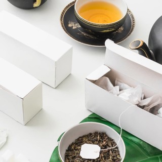 Tea bags white box with herbal tea white background