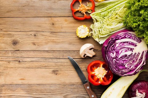 Vegetables assortment wooden background with copy space