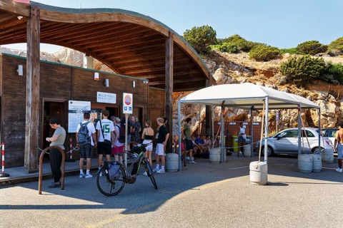 Group of tourists in front of the ticket office