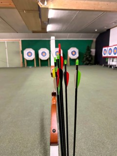Modern Shooting Range For Archery with Arch and Arrow in an Illuminated Underground Tunnel in Switzerland