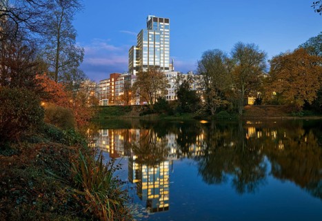 The LVA main building reflected in the Kaiserteich in autumn in the evening