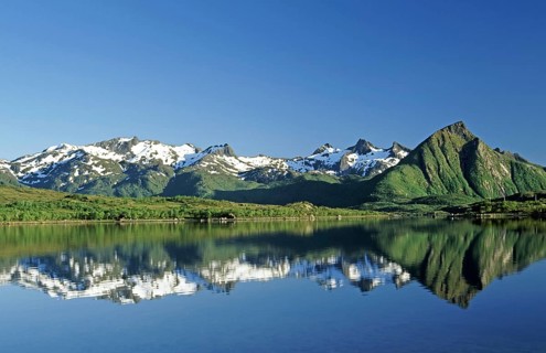 Reflection in lake of the Trolldalstinden mountains