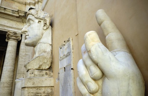 Colossal hand with index finger and head