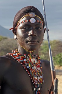 Portrait of Samburu warrior in traditional dress with spear