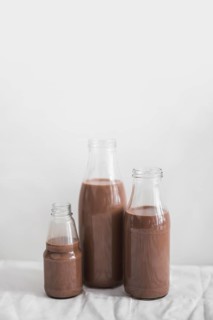 Still life chocolate milkshake bottle against white background