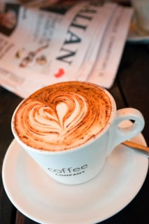 Cup of coffee with heart of milk foam
