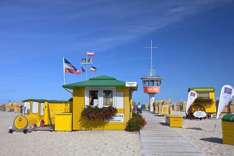 Roofed wicker beach chairs on the beach at Travemuende