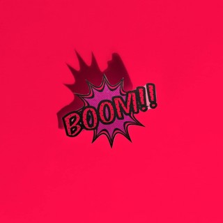 Boom comic text speech bubble pop art style sound effect red backdrop