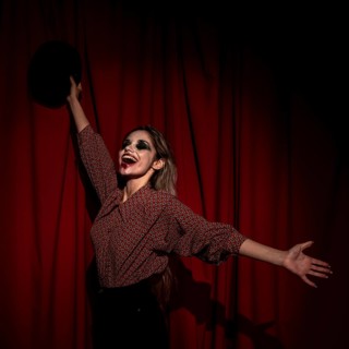 Side view woman dressed as clown being happy
