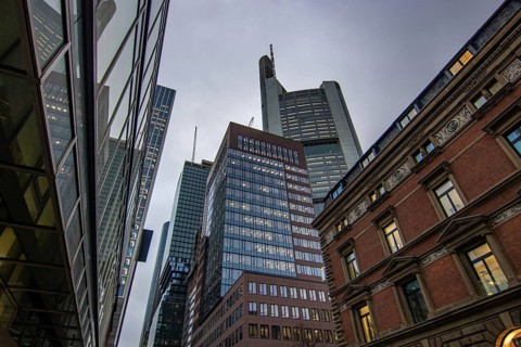 Reflection in a puddle between a historic city centre. Cityscape at the Roemer and the historic houses and streets. Cityscape in Frankfurt am Main