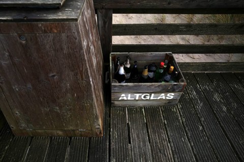 Empty champagne bottles in crate for disposal of waste glass