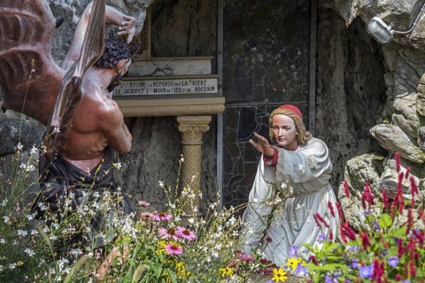 Sculpture of the devil and St Anthony of Padua at grotto in the village Crupet