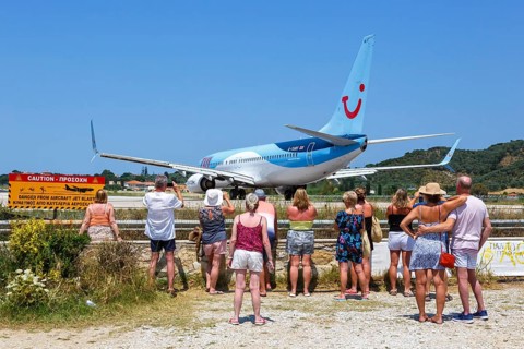 A TUI Boeing 737-800 aircraft with the registration G-TAWX at Skiathos Airport