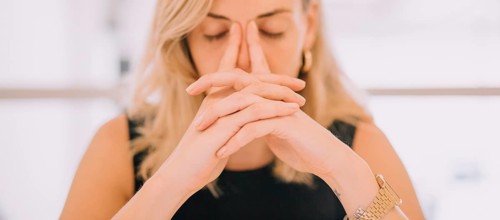 Close up young businesswoman with hands face