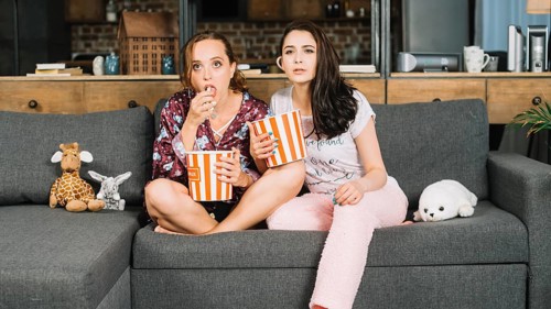 Young women watching television