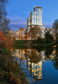 The LVA main building reflected in the Kaiserteich in autumn in the evening