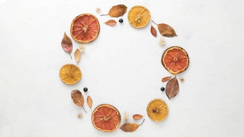 Top view autumn leaves with dried citrus