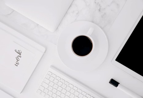 Work text diary digital tablet coffee cup keyboard black marker white desk