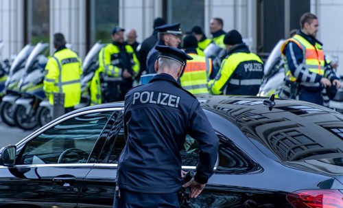 Police with yellow high-visibility waistcoats