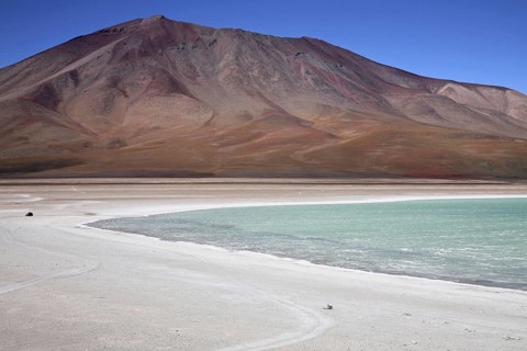 Four-wheel drive vehicle driving on dirt-track along the Laguna Verde