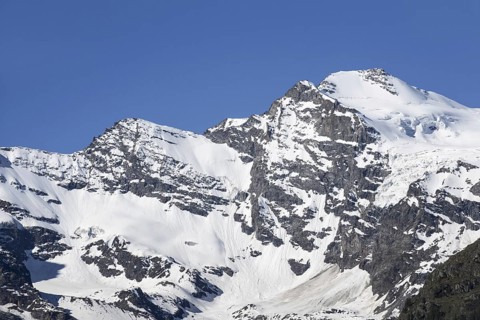 Snow covered mountain Gran Paradiso seen from Cogne in the Graian Alps
