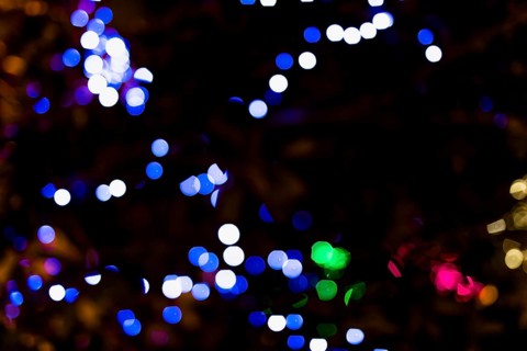 Illuminated color dot with darkness background