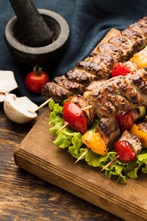 High angle delicious kebab with meat vegetables