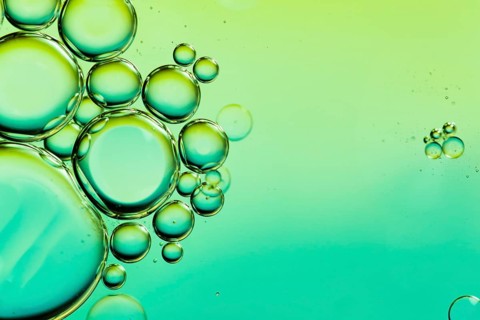 Oil drops water surface abstract background