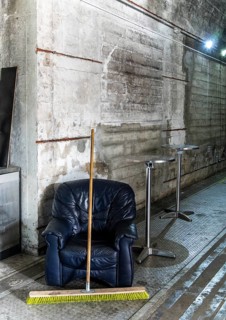 Leather armchairs and bistro tables inside a bunker
