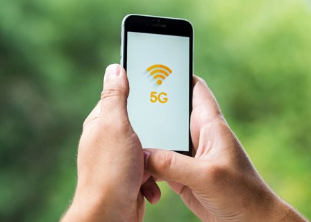 Phone with 5g screen held hands