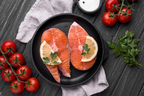 Slices raw red salmon top view