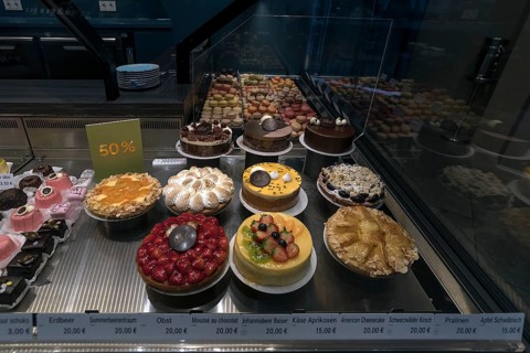 Various fruit cakes in a display in a confectionery