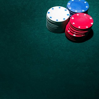 Stack casino chips green table