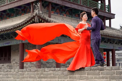Wedding couple standing on the city wall in Xian