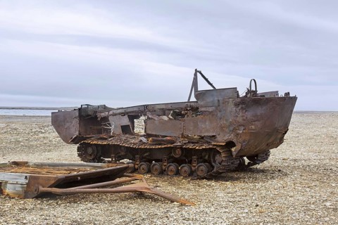 Rusty amphibian vehicle at deserted 1950s Kinnvika Arctic research station