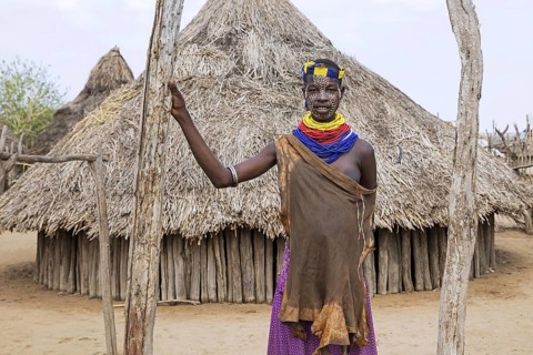 Black woman with painted face of the Karo