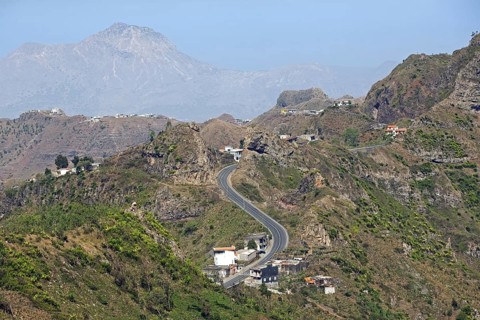Houses along winding road through the volcanic mountains in the interior of the island of Santiago