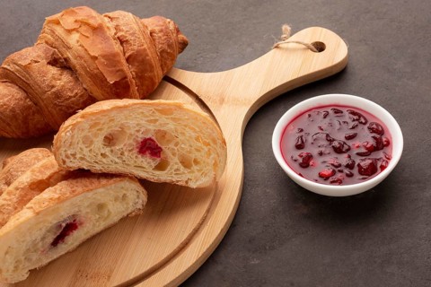 Sweet croissants with jam close up